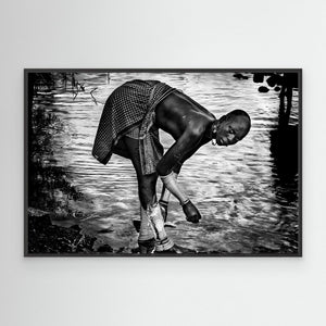 Surma Tribe Woman Washing up her Jewelry - Ethiopia by Joxe Inazio Kuesta Garmendia