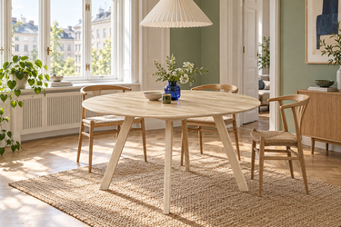 ELLIS Dining Table with Wooden Legs Ø140CM in a dining room