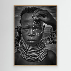 Painting the Face of a Karo Tribe Girl (Omo Valley-Ethiopia) by Joxe Inazio Kuesta Garmendia