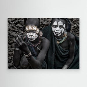Two surmi girl painting in the bank of a river - Ethiopia by Joxe Inazio Kuesta Garmendia
